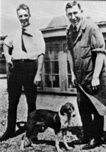 Banting and Best standing with one of the dogs they tested on