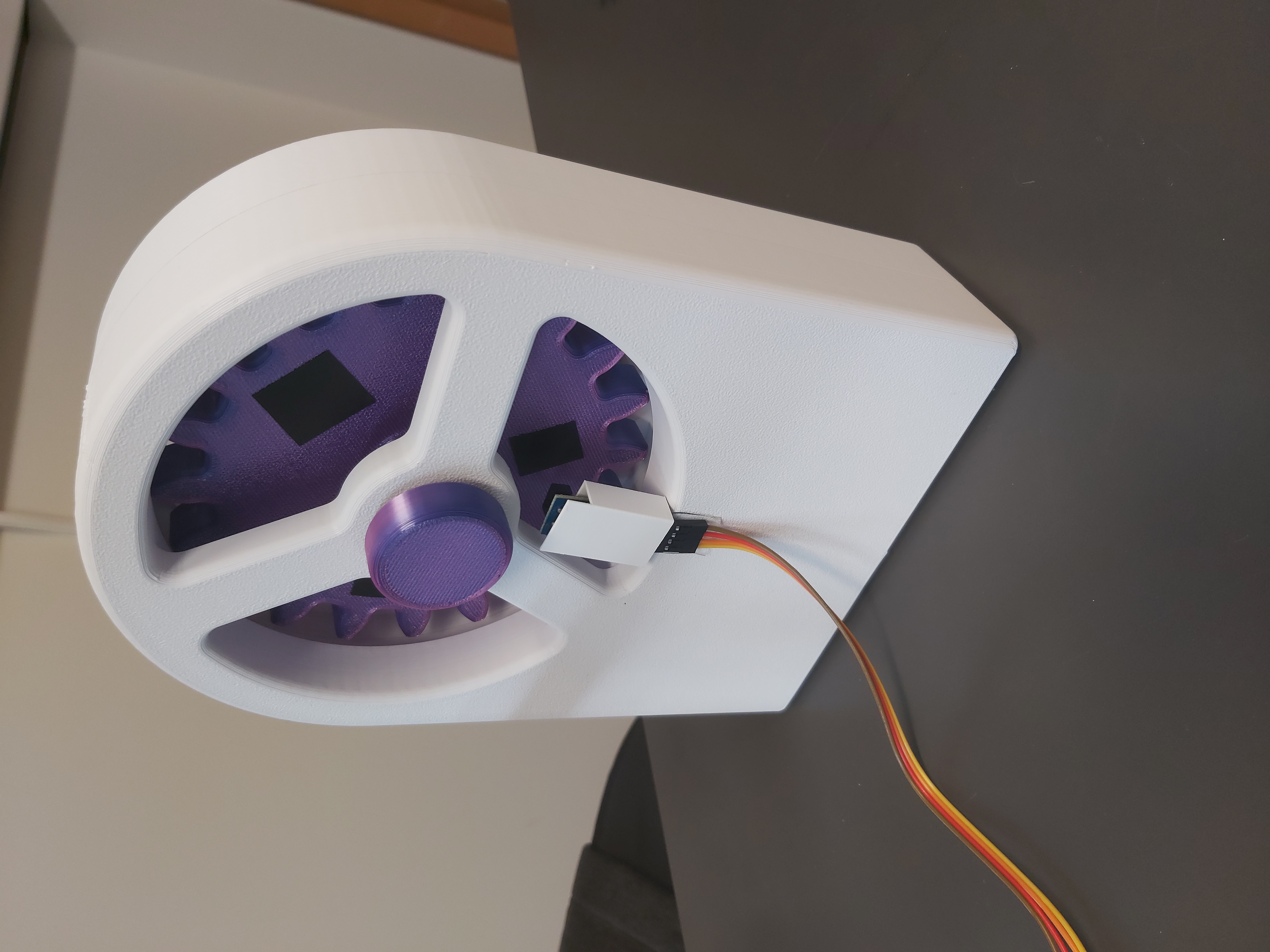 Close-up view of hand crank and its light sensor