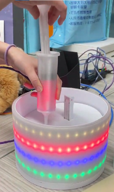 The syringe currently selecting the red layer from the layer container